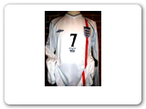David Beckham's embroidered jersey from the 2002 World Cup match against Brazil. One of the modern games most well-know icons who draws thousands of fans around the globe. He has been Captain of England and starred with Manchester United and Real Madrid. He currently plays for the Los Angeles Galaxy in the United States. 